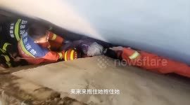 Chinese firefighters navigate narrow wall gap to save trapped 90-year-old