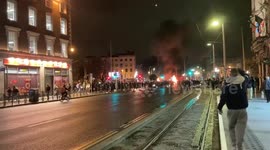 Violent unrest erupts in Dublin following stabbing: protesters set Garda car and bus ablaze in O'Connell Street