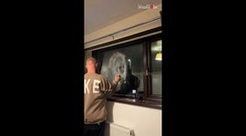 Man makes Kevin from Home Alone on the window of bathroom using shave foam