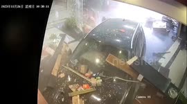 Quick-thinking Chinese receptionist narrowly escapes death as out-of-control BMW crashes into restaurant