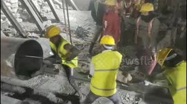 Rescue workers break through to Indian workers trapped in collapsed tunnel for more than 2 weeks