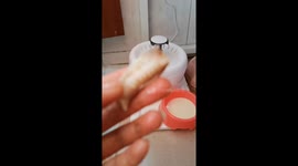 Woman gives carefully postnatal care to mother cat in Chinese traditional way