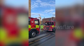 Crane collapses and crashes into building site in Edinburgh