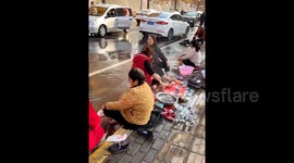 Hot springs emerge on village road, drawing crowds in China