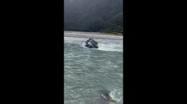 SUV Gets Stuck in Rising River