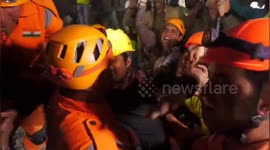 India: First moments for workers freed after being trapped in collapsed tunnel for 17 days