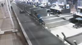 Toddler goes for a baggage belt ride at airport in Chile