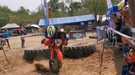 Biker loses control and crashes into spectators during motocross race in Thailand