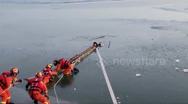 Heroic firefighters rescue two boys from frozen river in China