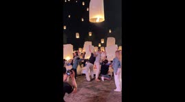 Beautiful moment boyfriend proposes as thousands of lanterns are released