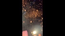Locals release hundreds of floating lanterns into the sky for annual Yi Peng Festival in northern Thailand