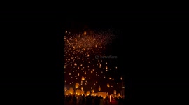 Spectacular moment floating lanterns are released into the sky for Thai lantern festival