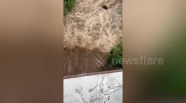 Teenagers rescued from raging river amid floods in Indonesia