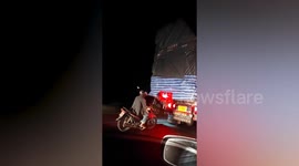 Tailgating motorcyclist tempts fate as he drives dangerously close to truck in Thailand