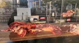 Mouse spotted gnawing on meat in Chinese hotpot restaurant
