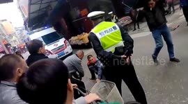 Scooter rider injured as Chinese traffic police officer wields baton in aggressive enforcement incident