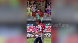 Man plays sex puppets in front of coyote dancers at festival