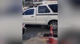 Motorcycles fall over slippery road due to accident oil slick