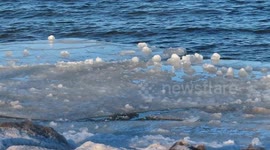 Cool ice balls forming on floating ice on Lake Superior Ashland WI