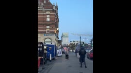 Yobs let off fireworks in street with one landing inches from pedestrian