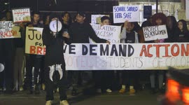 Protestors speak out against a racial hate crime attack of a Shawnee Mission East High School student in Shawnee Mission Kansas, United States of America