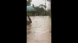 Locals wade through severe flash flood in southern Thailand