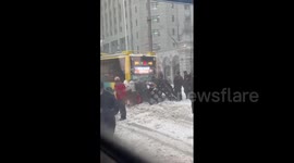 China: Passengers Band Together To Help Push Bus Stuck On Snowy Road In Harbin