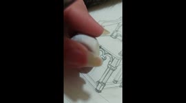 Artist Uses Cat's Tail To Brush Away Eraser Shavings