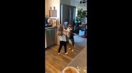 Girl Sweetly Serenades Dog