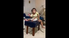 Chair mishap: toddlers' tumble caught on camera