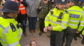 Just Stop Oil activist arrested outside New Scotland Yard as they protest against the jailing of climate activists