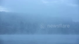 Heavy fog and mist covers the area at Llwyn Onn reservoir, Merthyr Tydfil, South Wales, UK