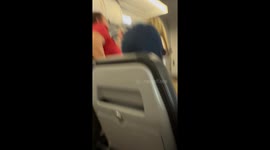 Woman Threatens to Urinate in Aisle  During Flight