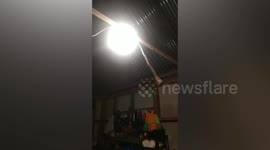 Dangling power plug swings as Philippine earthquake rattles home