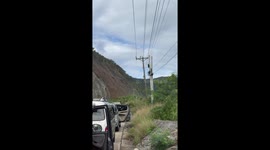 Drivers flee as landslide sweeps down mountain slope in the Philippines