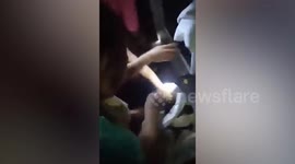 Abandoned newborn baby found alive and covered in ants in overgrown lot in the Philippines