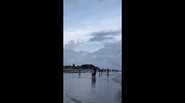 Locals catch shellfish in Vietnamese village