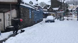 The beginning of snow clearing in Ambleside Village , Cumbria, U.K.