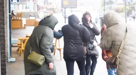 UK Weather, Winter weather sends strong winds to scatter shoppers in West Britain. Newquay Cornwall UK