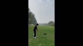 Golf player tees off with a shovel on course in China