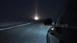 Driver captures ultra-rare 'moon halo' in frozen wilderness
