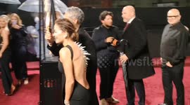 Rita Ora arrives with a Godzilla like back at the Fashion Awards held at The Royal Albert Hall