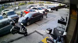 Helmet shields Chinese scooter rider from serious injuries after tripping over loose drain cover