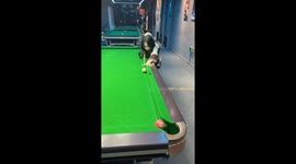 Pool player pulls trick shot by hitting chalk and potting ball