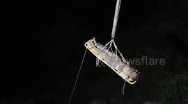 Officials rescue driver after truck falls into ditch in northern India