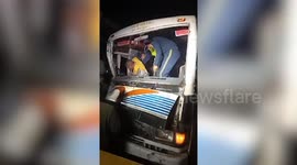 Officials rescue bus driver after vehicle collides with bus in northern India