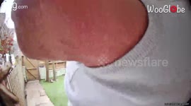 Man with untied shoelaces trips and headbutts the front door on his way out