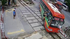 Bus Crashes Into Railroad Crossing Gate
