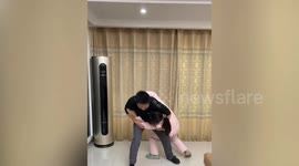 Loyal pet Golden Retriever helps wife win against husband in wrestling game