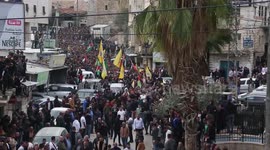 Palestinian mourners walk in the funeral procession of Anas and Mohammed al-Froukh, who were fatally shot during a raid by Israeli troops the previous night on Sair,